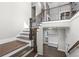 Grand staircase with dark wood and metal railings at 1200 Primrose Park Rd, Sugar Hill, GA 30518