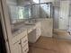 Luxurious bathroom featuring a dual sink vanity, tiled glass-enclosed shower, and modern fixtures at 138 Laurel Farms Ln, Dallas, GA 30157