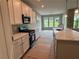 New kitchen with stainless steel appliances and white cabinets; island in the foreground at 125 Laurel Farms Ln, Dallas, GA 30157