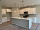 New kitchen featuring white cabinets, marble countertops, and stainless steel appliances at 125 Laurel Farms Ln, Dallas, GA 30157
