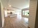 Open-concept living room and kitchen space with hardwood floors and ample natural light at 125 Laurel Farms Ln, Dallas, GA 30157