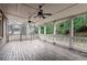 Expansive covered back deck featuring ceiling fans and decorative lighting, perfect for outdoor relaxation and entertaining at 2733 Caldwell Rd, Brookhaven, GA 30319