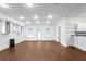 Open basement area with recessed lighting, a bar area, and outdoor access, perfect for entertaining guests at 2733 Caldwell Rd, Brookhaven, GA 30319