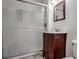 Bathroom with a sleek vanity, mirror, and a glass-enclosed shower, offering a modern and functional space at 2733 Caldwell Rd, Brookhaven, GA 30319