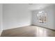 Bright bedroom with hardwood floors, large windows, and neutral paint, creating a serene and inviting space at 2733 Caldwell Rd, Brookhaven, GA 30319