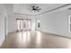 Expansive bedroom with a tray ceiling, hardwood floors, and abundant natural light streaming through large windows at 2733 Caldwell Rd, Brookhaven, GA 30319
