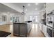 Open concept kitchen with gray island, stainless steel appliances, and natural light at 2733 Caldwell Rd, Brookhaven, GA 30319