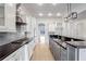 Gourmet kitchen with long countertops, stainless appliances, and hardwood floors at 2733 Caldwell Rd, Brookhaven, GA 30319