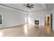 Spacious main bedroom with hardwood floors, a tray ceiling, a fireplace, and ample natural light at 2733 Caldwell Rd, Brookhaven, GA 30319