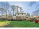 Large backyard with mature trees and a deck at 2736 Old Norcross Rd, Tucker, GA 30084