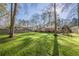 Lush backyard with mature trees and play area at 2736 Old Norcross Rd, Tucker, GA 30084
