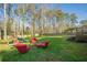 Large, fenced backyard with a fire pit and play set at 2736 Old Norcross Rd, Tucker, GA 30084