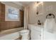 Bathroom featuring a tub-shower combination, modern fixtures, and neutral tile at 2736 Old Norcross Rd, Tucker, GA 30084