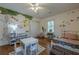 Whimsical bedroom with playful wall murals and hardwood floors at 2736 Old Norcross Rd, Tucker, GA 30084