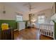 Cozy bedroom with hardwood floors, a crib, and a dresser at 2736 Old Norcross Rd, Tucker, GA 30084
