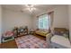 Bright bedroom with hardwood floors, shelves and a patterned rug at 2736 Old Norcross Rd, Tucker, GA 30084