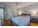Bedroom featuring hardwood floors, soft lighting, and neutral decor at 2736 Old Norcross Rd, Tucker, GA 30084