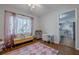 Bedroom featuring hardwood floors, soft lighting, and a view to the kitchen at 2736 Old Norcross Rd, Tucker, GA 30084