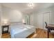 Bright bedroom with a bed, hardwood floors, desk, and closet at 2736 Old Norcross Rd, Tucker, GA 30084