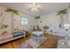 Bright bedroom featuring hardwood floors, playful wall art, and ample natural light at 2736 Old Norcross Rd, Tucker, GA 30084