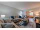 Bright living room features comfortable seating, a stylish rug, and a view into another room at 2736 Old Norcross Rd, Tucker, GA 30084