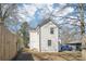 Back exterior view of a white two-story home with a fenced yard at 260 Westview Sw Pl, Atlanta, GA 30314