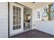 Balcony with access to primary bedroom featuring white trim and dark wood floor at 260 Westview Sw Pl, Atlanta, GA 30314