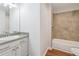 Bathroom featuring tile shower, vanity with sink and tiled floor at 260 Westview Sw Pl, Atlanta, GA 30314