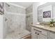 Modern bathroom featuring a shower with a tile surround and double sinks at 260 Westview Sw Pl, Atlanta, GA 30314