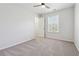 Bright bedroom featuring a ceiling fan, neutral walls, plush carpeting, and a closet at 260 Westview Sw Pl, Atlanta, GA 30314