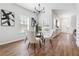 Modern dining room featuring hardwood floors, bright chairs and open access to the front door at 260 Westview Sw Pl, Atlanta, GA 30314