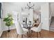 Bright dining area featuring a glass table, sleek chairs, and hardwood floors at 260 Westview Sw Pl, Atlanta, GA 30314