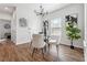 Cozy dining room with modern chandelier, hardwood floors, and neutral decor at 260 Westview Sw Pl, Atlanta, GA 30314
