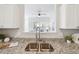 Bright kitchen features stainless steel sink, granite countertops, and an open view at 260 Westview Sw Pl, Atlanta, GA 30314