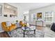 Stylish living room featuring wood floors, sleek furniture, and a view of the kitchen at 260 Westview Sw Pl, Atlanta, GA 30314