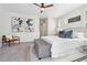 Spacious main bedroom with two windows, ceiling fan and stylish decor at 260 Westview Sw Pl, Atlanta, GA 30314