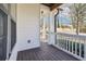 Cozy covered porch featuring a white railing and dark wood floors at 260 Westview Sw Pl, Atlanta, GA 30314