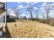 Expansive backyard provides ample space for outdoor activities, featuring a gentle slope and mature trees at 2801 Univeter Rd, Canton, GA 30115