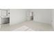 Open bedroom featuring a neutral carpet, an entrance to a bathroom and a staircase to the second floor at 2801 Univeter Rd, Canton, GA 30115