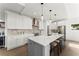 Gourmet kitchen with stainless steel appliances, a large center island, and pendant lighting at 2801 Univeter Rd, Canton, GA 30115