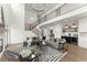 Open-concept living room with high ceilings, a stylish staircase, and a view to the kitchen at 2801 Univeter Rd, Canton, GA 30115