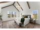 This main bedroom features vaulted ceilings, exposed beams, and large windows at 2801 Univeter Rd, Canton, GA 30115