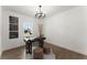 Bright home office features modern lighting, decor, and hardwood flooring at 2801 Univeter Rd, Canton, GA 30115
