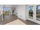 Covered porch with wood flooring, white railings, and a view of the serene backyard at 2801 Univeter Rd, Canton, GA 30115