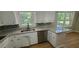 Bright kitchen with stainless steel dishwasher, granite countertops, and a modern backsplash at 3879 Artist Vw, Decatur, GA 30034