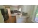 Modern kitchen with white cabinets, granite countertops, and stainless steel appliances at 3879 Artist Vw, Decatur, GA 30034
