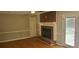 Cozy living room with hardwood floors, fireplace, and neutral wall color at 3879 Artist Vw, Decatur, GA 30034