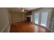 Inviting living room featuring hardwood floors, brick fireplace and French doors at 3879 Artist Vw, Decatur, GA 30034