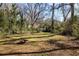 Large backyard with a fire pit for outdoor entertaining at 1244 Lorenzo Sw Dr, Atlanta, GA 30310