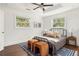 Inviting bedroom with dark wood floors and a comfortable bed at 1244 Lorenzo Sw Dr, Atlanta, GA 30310